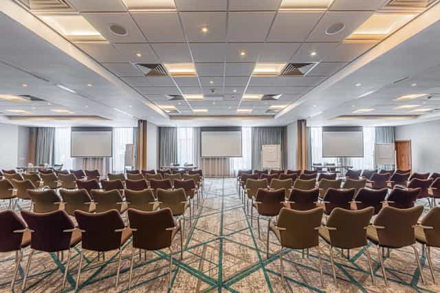 Buckingham Suite conference room with comfortable chairs, ideal for corporate events.
