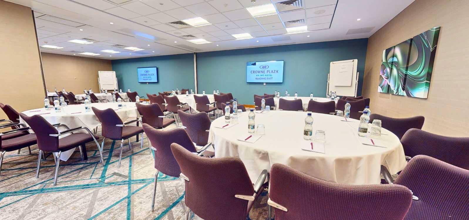 Frogmore Suite meeting room with round tables for corporate events in Crowne Plaza Reading East.