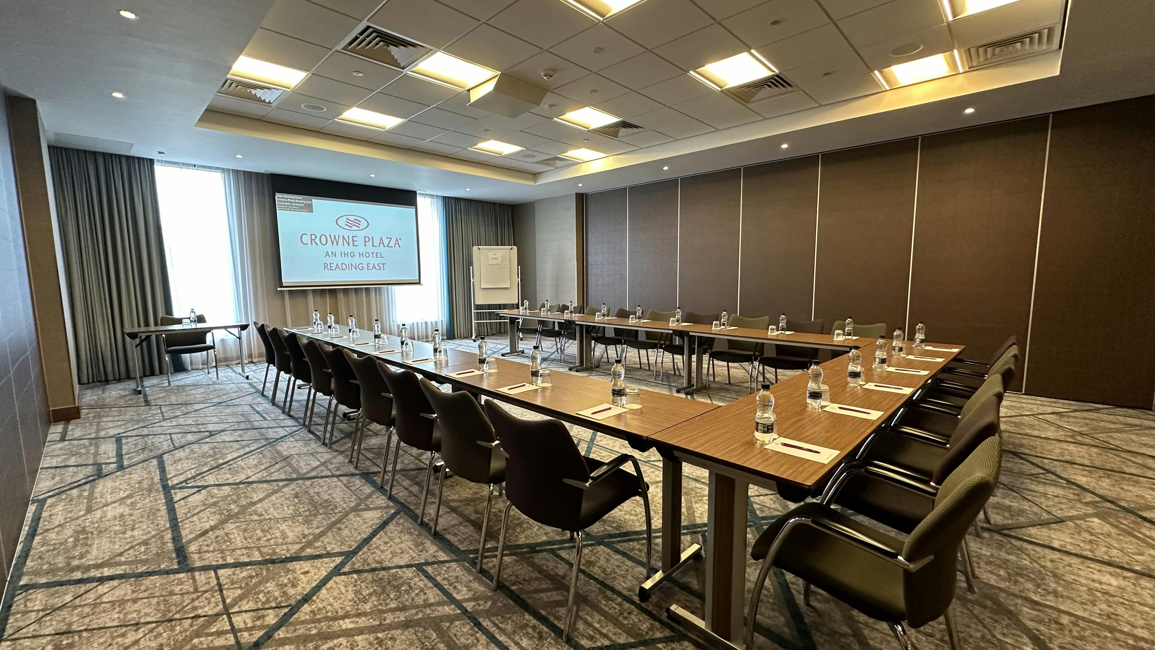 Corporate meeting room at Crowne Plaza Reading East with U-shaped seating and natural light.