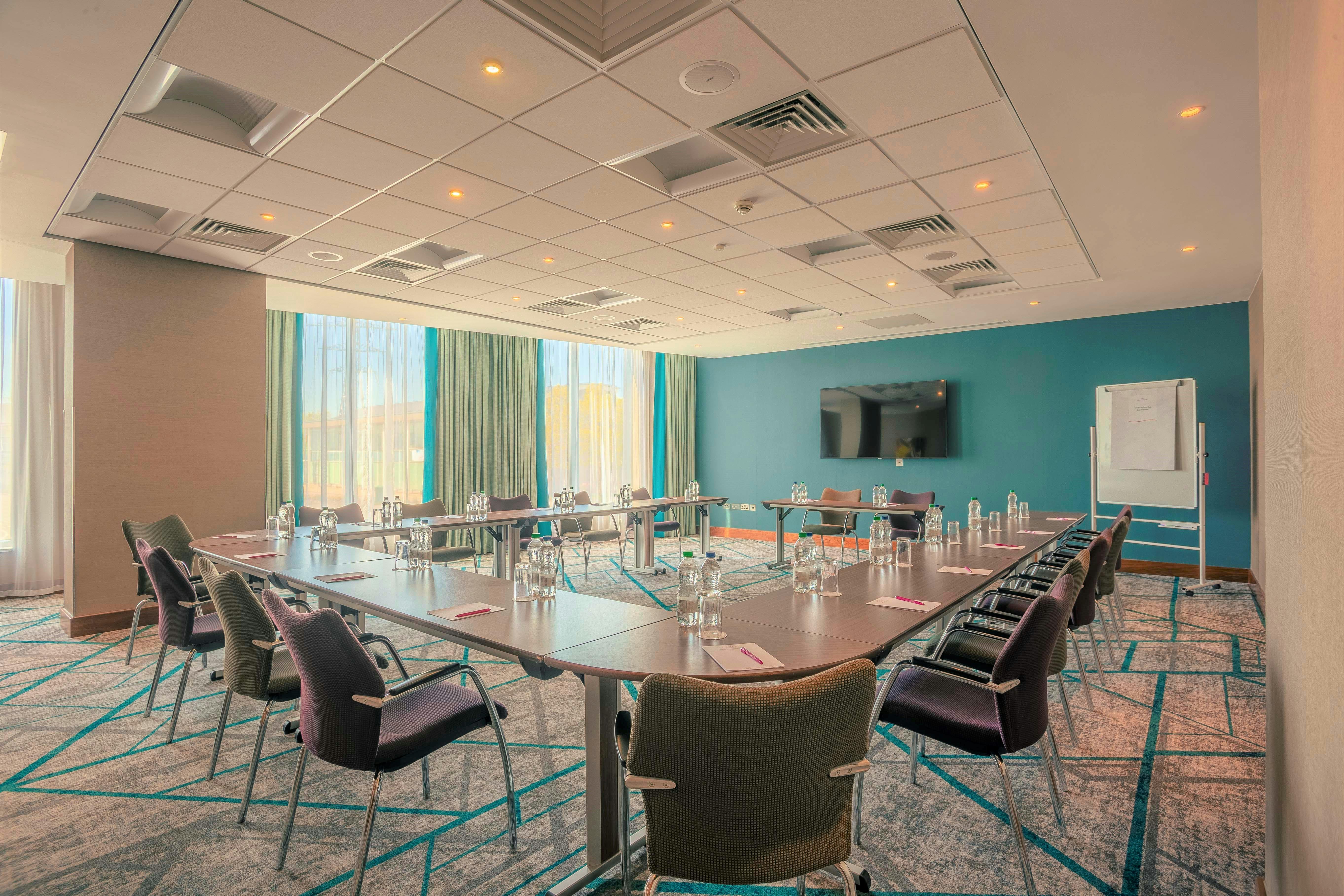 Modern meeting room at Crowne Plaza Reading East, ideal for professional events and presentations.