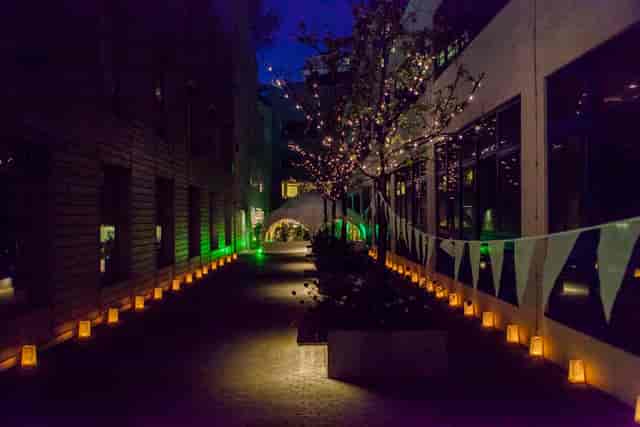 Outdoor illuminated venue with lanterns, perfect for receptions and social gatherings.