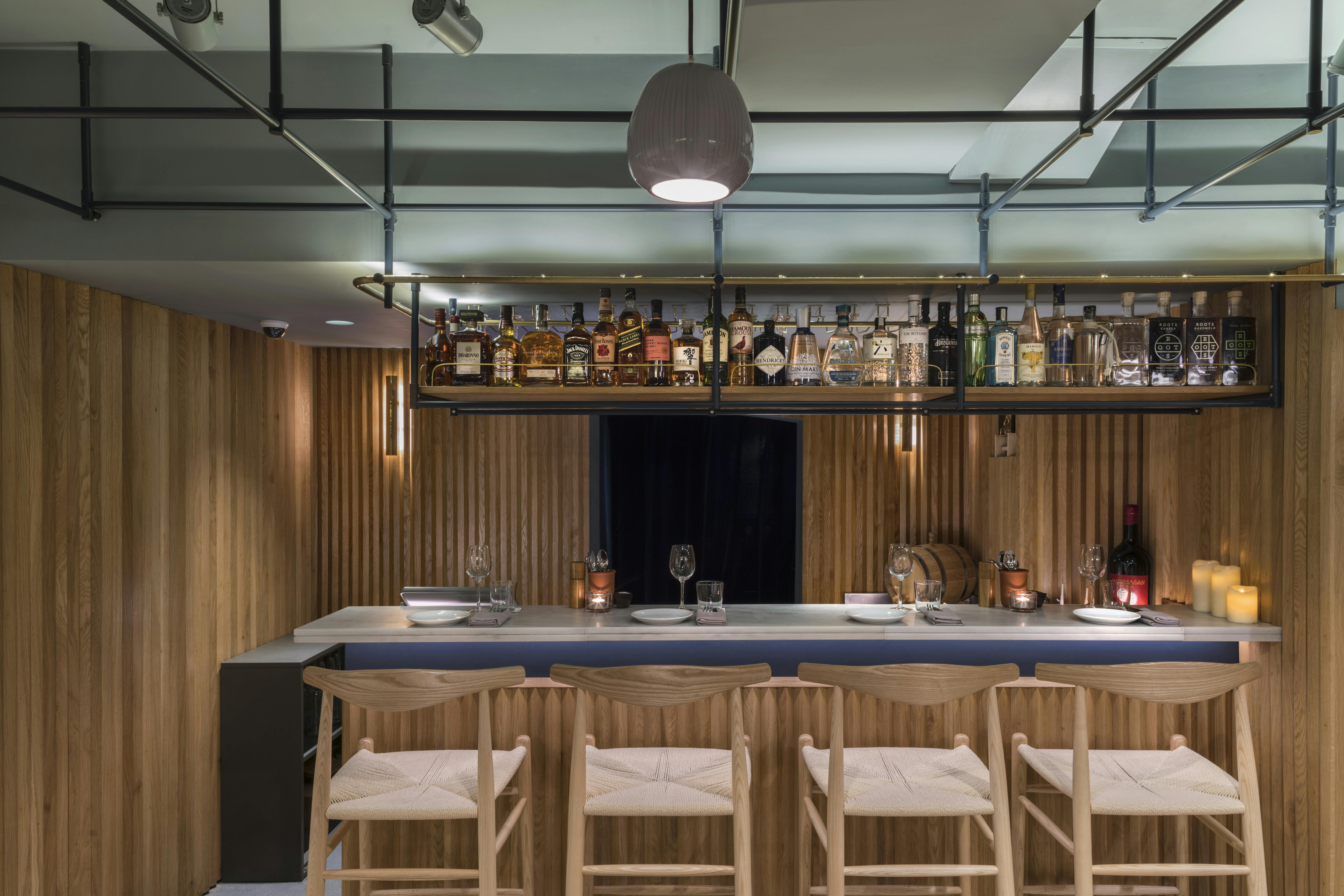 Sleek bar area in The Larder Room, ideal for networking events and cocktail receptions.