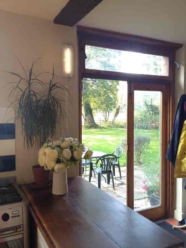 Apple Orchard Farmhouse Kitchen with large windows, ideal for retreats and events.