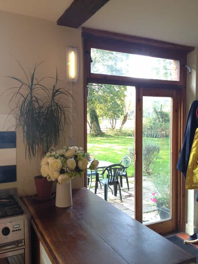 Apple Orchard Farmhouse Kitchen with large windows, ideal for retreats and events.