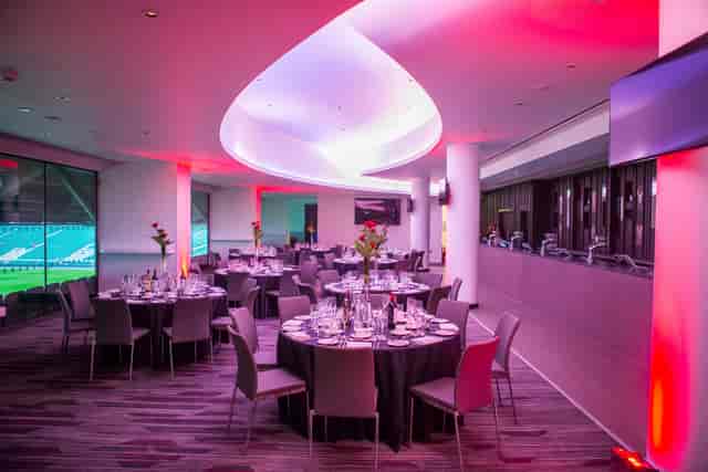 Allianz Stadium Members' Lounge set for a formal dinner with elegant table settings.