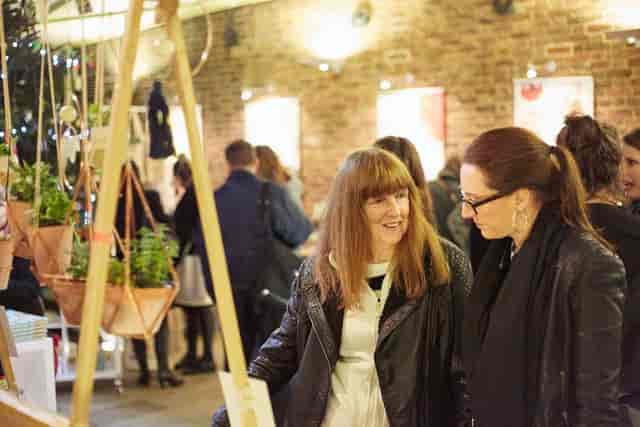 Vibrant networking event in Garden Atrium, Museum of the Home with stylish decor and greenery.