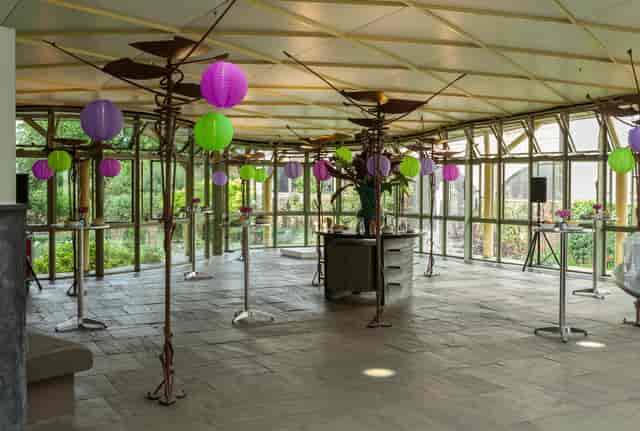 Vibrant Garden Atrium with colorful lanterns, ideal for networking events and receptions.