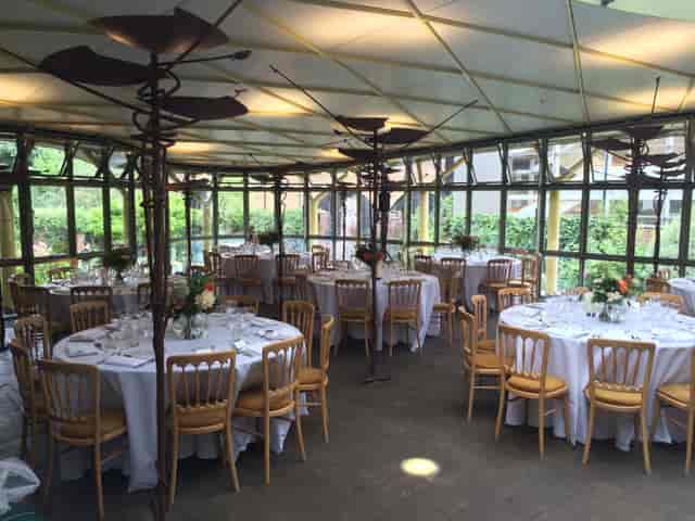 Garden Atrium event space with elegant table settings for formal dinners and gatherings.