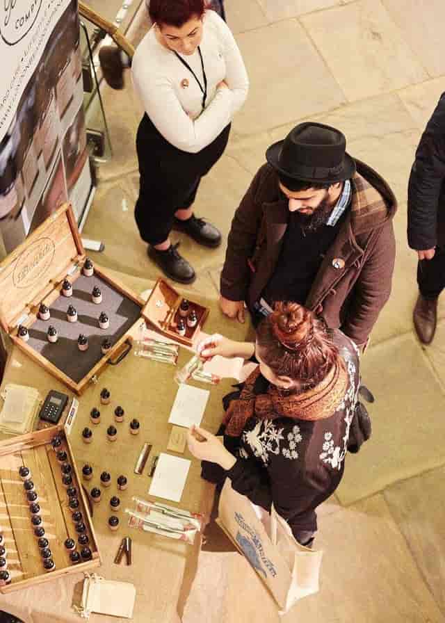 Contemporary Gallery event with vendor booth showcasing artisanal products and networking.