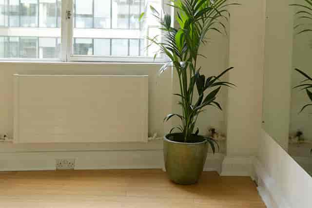 Bright minimalist meeting space with large window, ideal for brainstorming sessions in London.