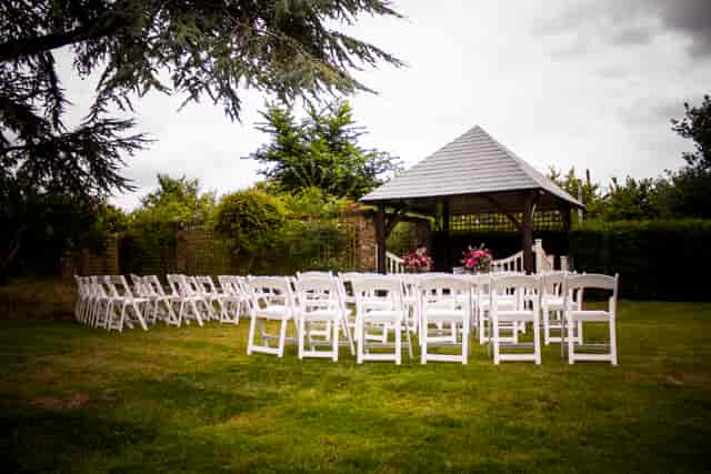 Outdoor wedding ceremony at The Manor Somerset Estate featuring a rustic wooden gazebo.