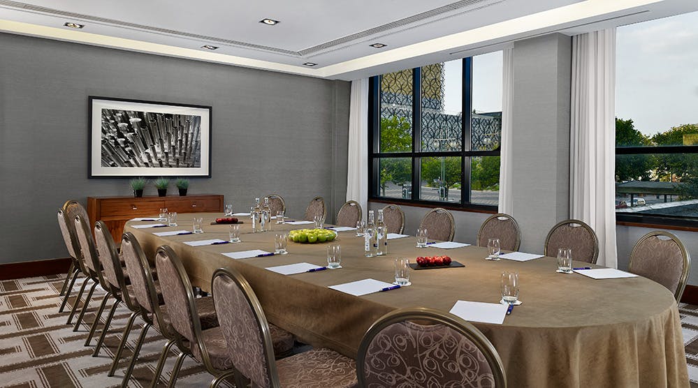 Meeting room at Hyatt Regency Birmingham, featuring a long table for corporate events.