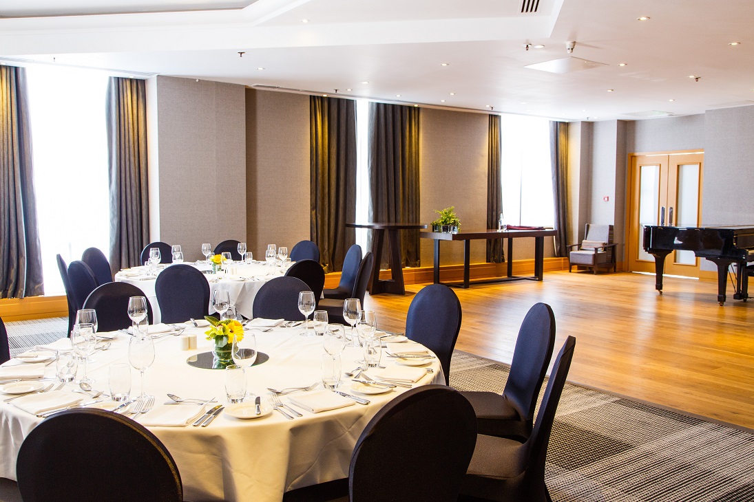 Sonata Suite at Hyatt Regency Birmingham, elegant event space with floral centerpieces. - Banner