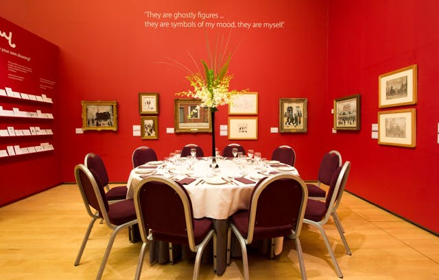 Elegant round table in The Law Family Galleries, ideal for corporate events and gatherings.