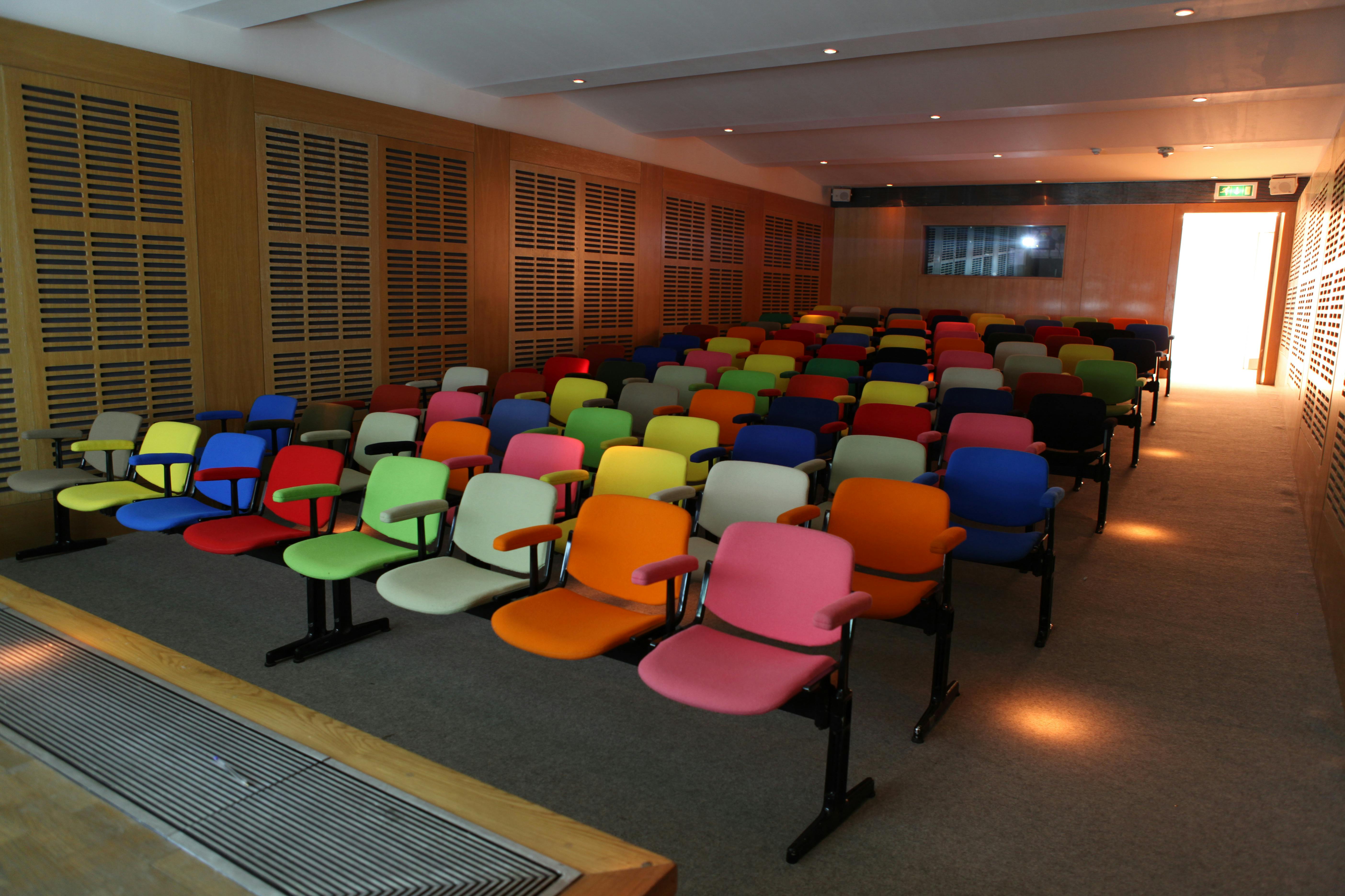 Zilkha Auditorium with vibrant seating, ideal for creative workshops and interactive events.