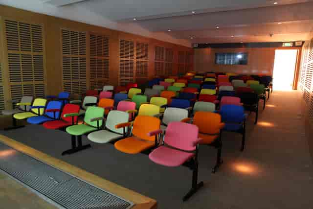 Zilkha Auditorium with vibrant seating, ideal for creative workshops and interactive events.