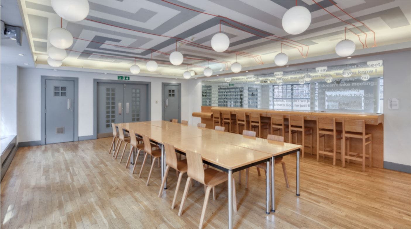 Modern meeting space in Whitechapel Gallery with a long wooden table for workshops.