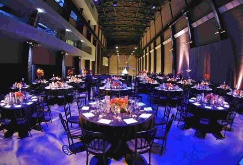 Turbine Hall at Tate Modern set for a formal dinner with elegant tables and centerpieces.