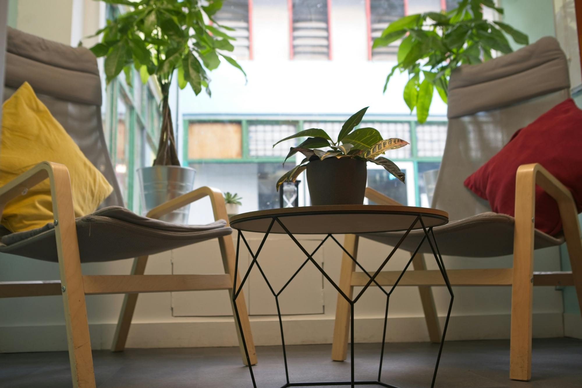 Cozy meeting space in Impact Brixton with vibrant cushions for brainstorming sessions.