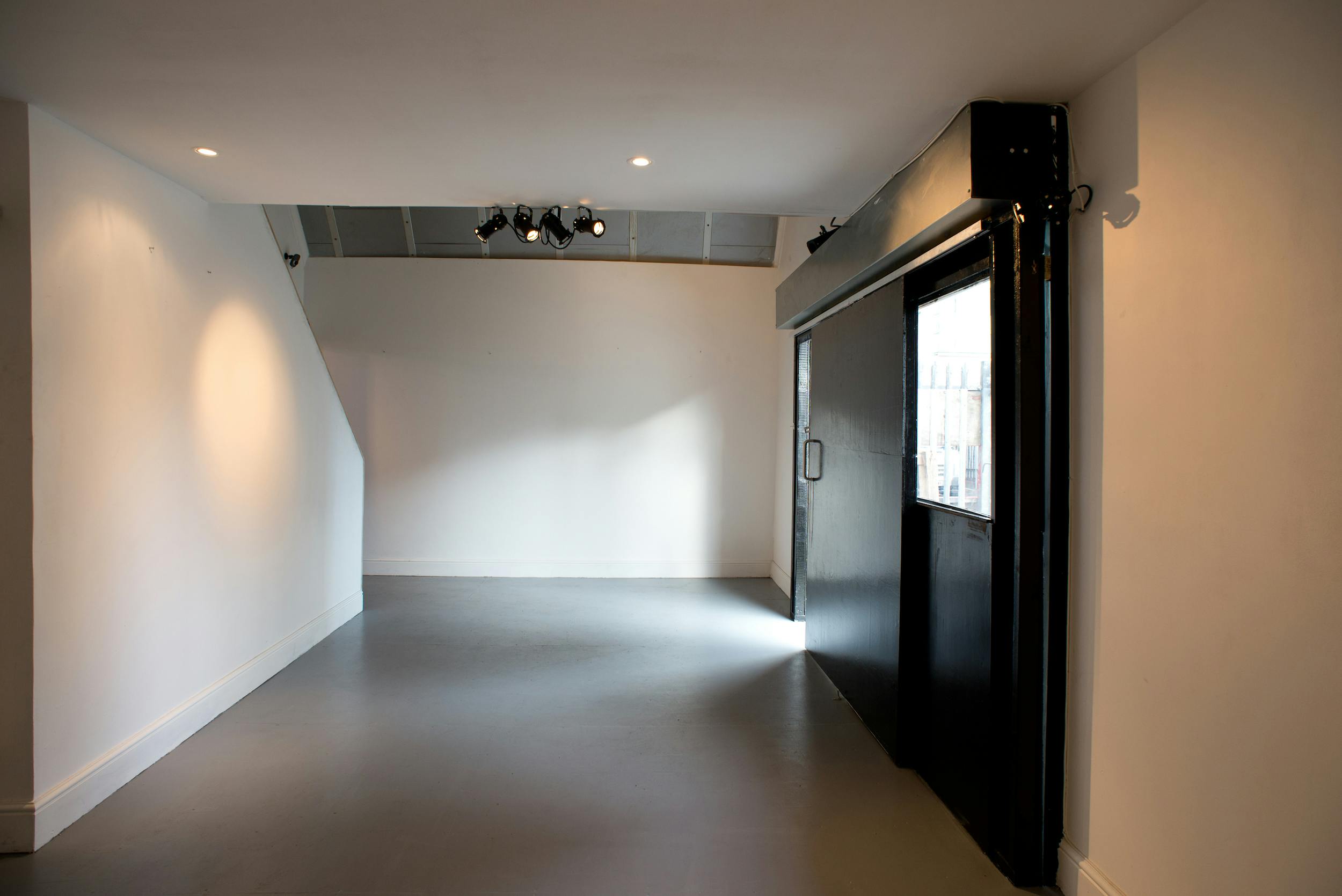 Versatile event space with natural light at Samurai Creative Hub for meetings and workshops.