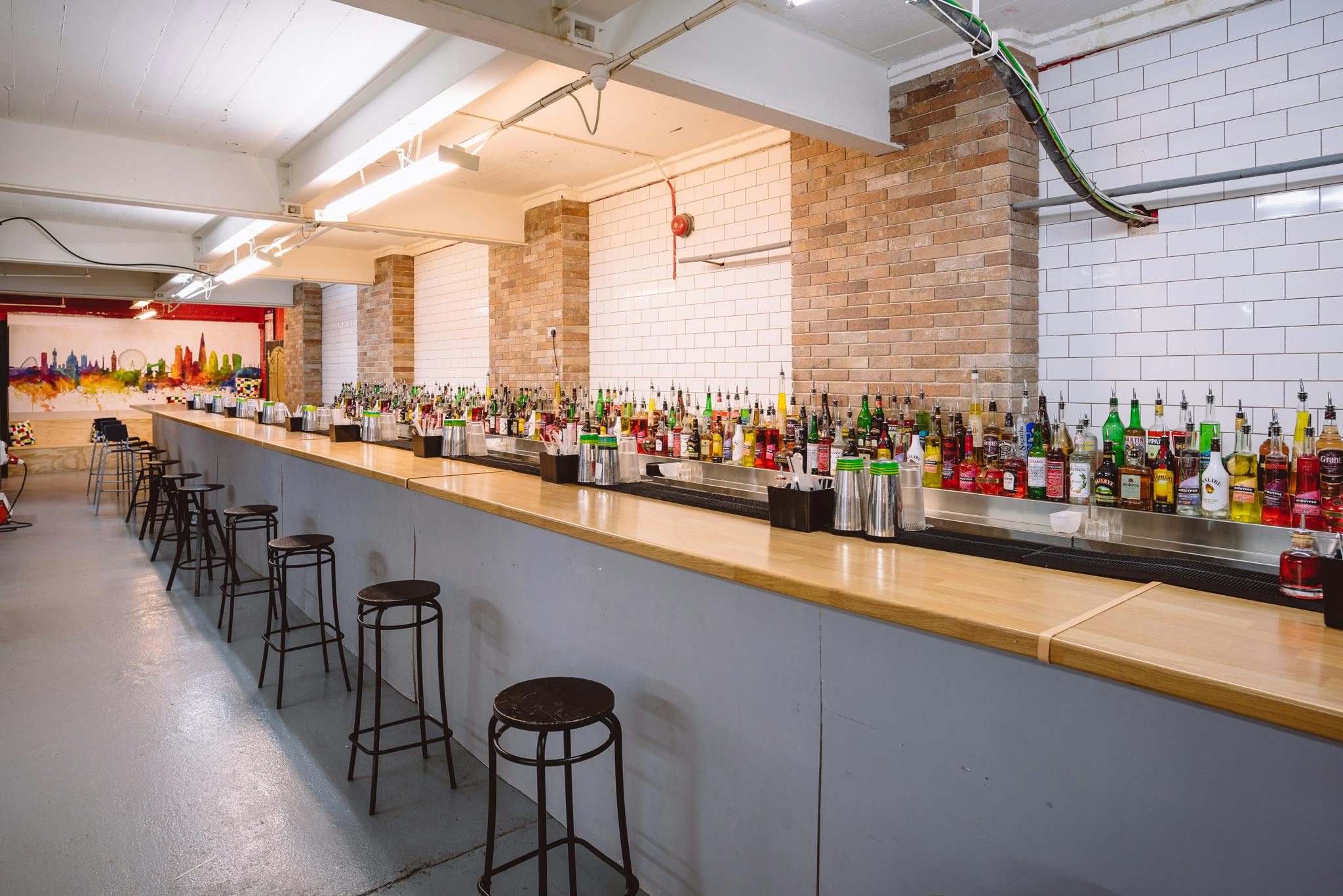 Main Room at London Bartender School, modern bar for networking events and social gatherings.