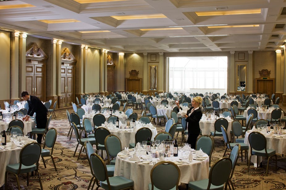 Empress Suite banquet hall setup for formal events with elegant round tables.