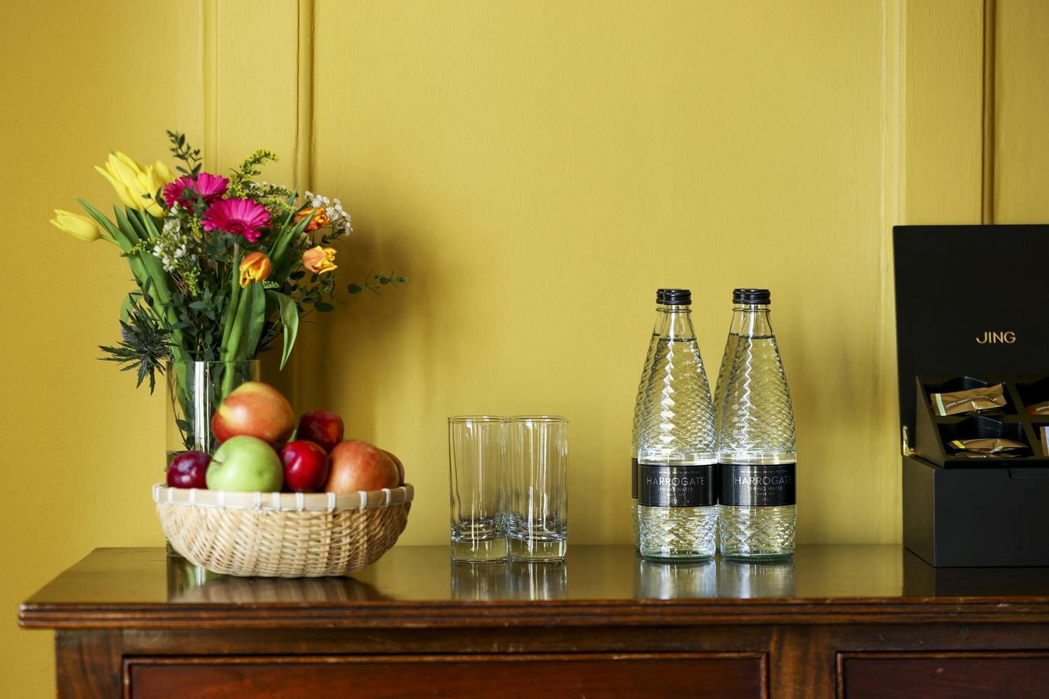 Queen's Room refreshment station with flowers, ideal for meetings and events.