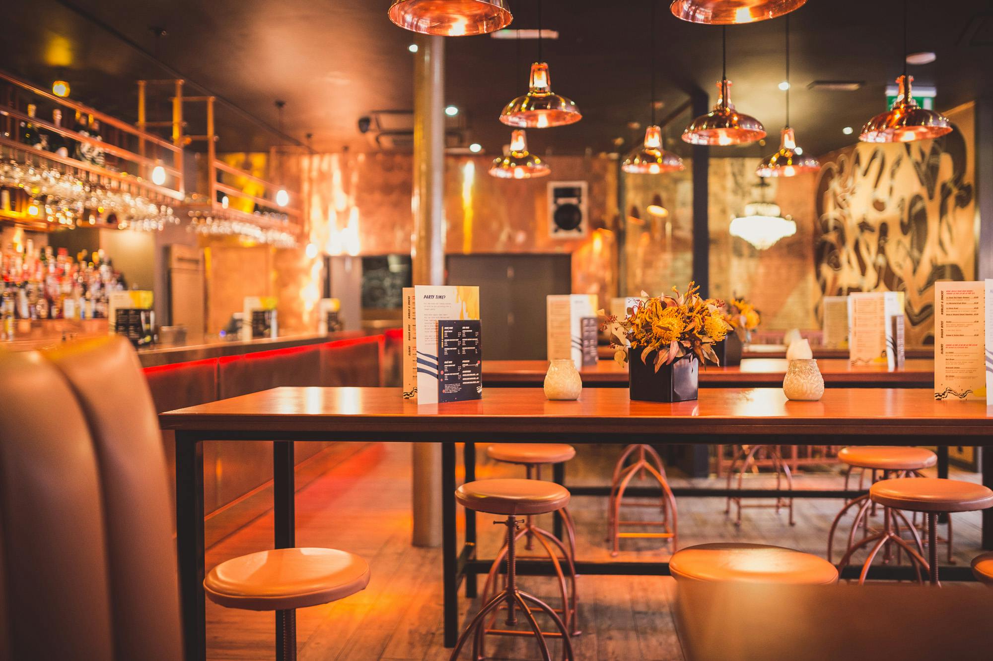 Stylish venue with warm lighting, perfect for intimate gatherings and networking events.