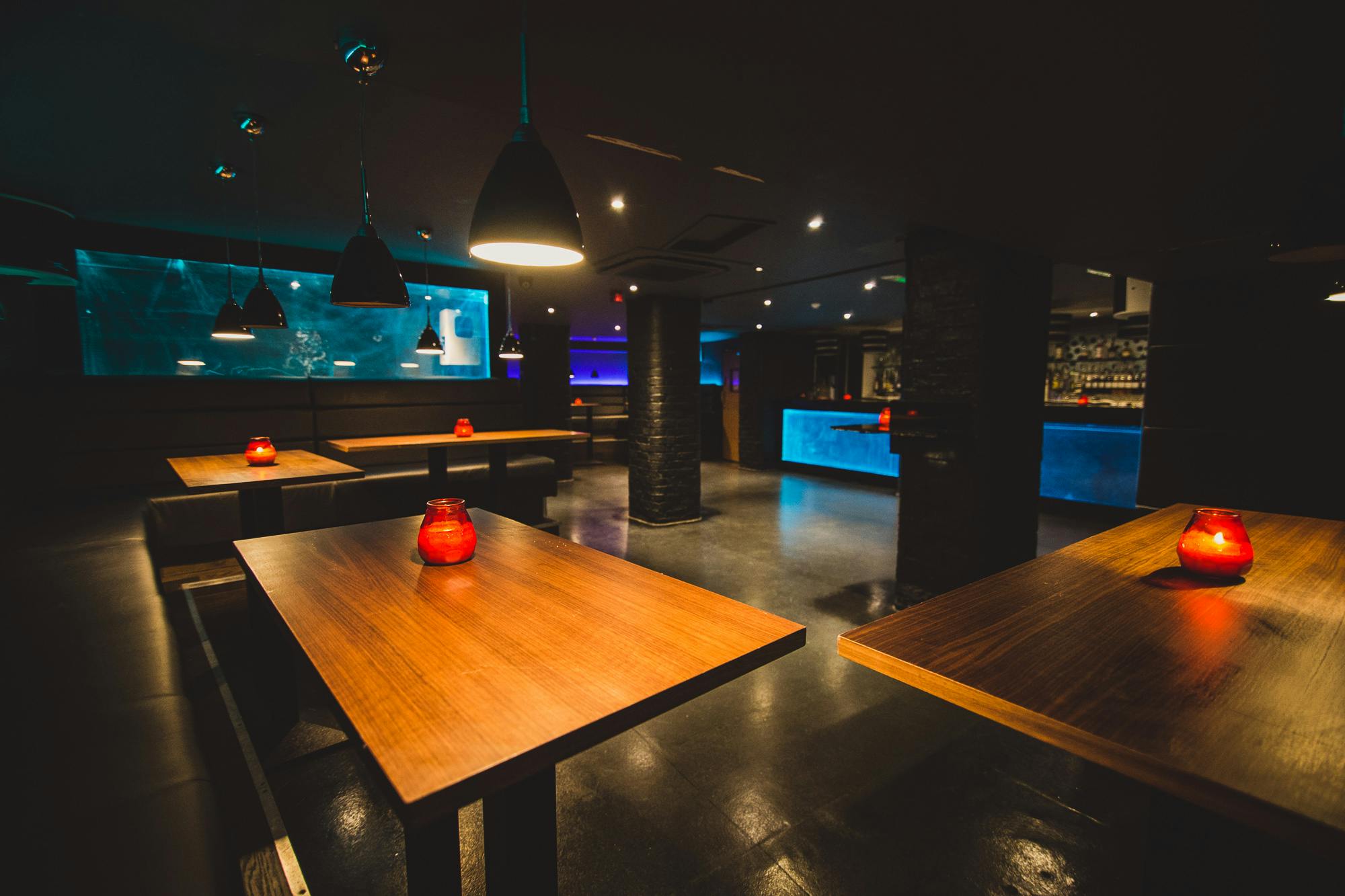 Modern event space in Walrus with wooden tables, ideal for networking receptions.