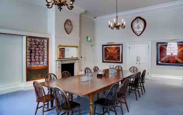 Medal Room at HAC: elegant meeting space for corporate gatherings with a long wooden table.