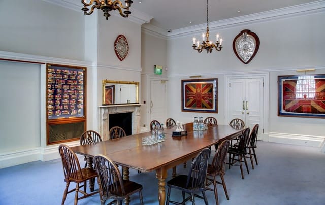 Medal Room at HAC: elegant meeting space for corporate gatherings with a long wooden table.