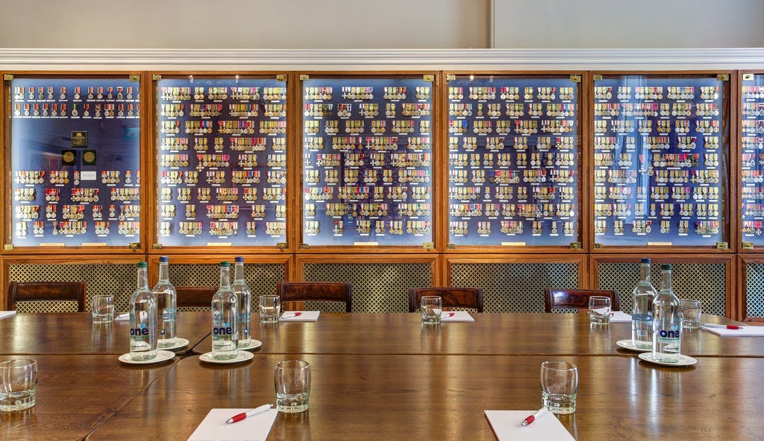 Medal Room at HAC: elegant meeting space with wooden table, ideal for professional events.