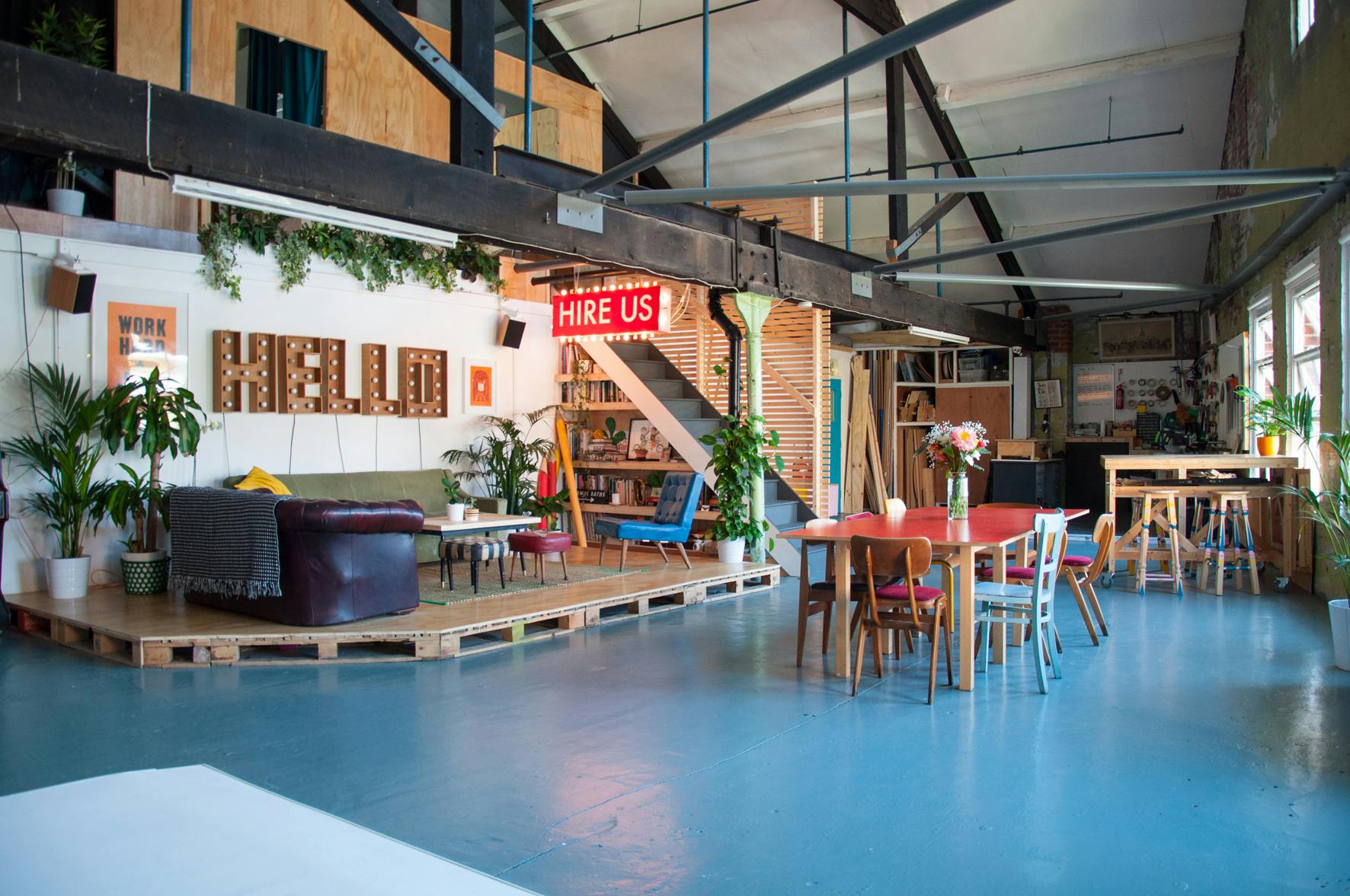 Versatile event space in Lord Whitney Studio with vibrant decor and greenery for hire.