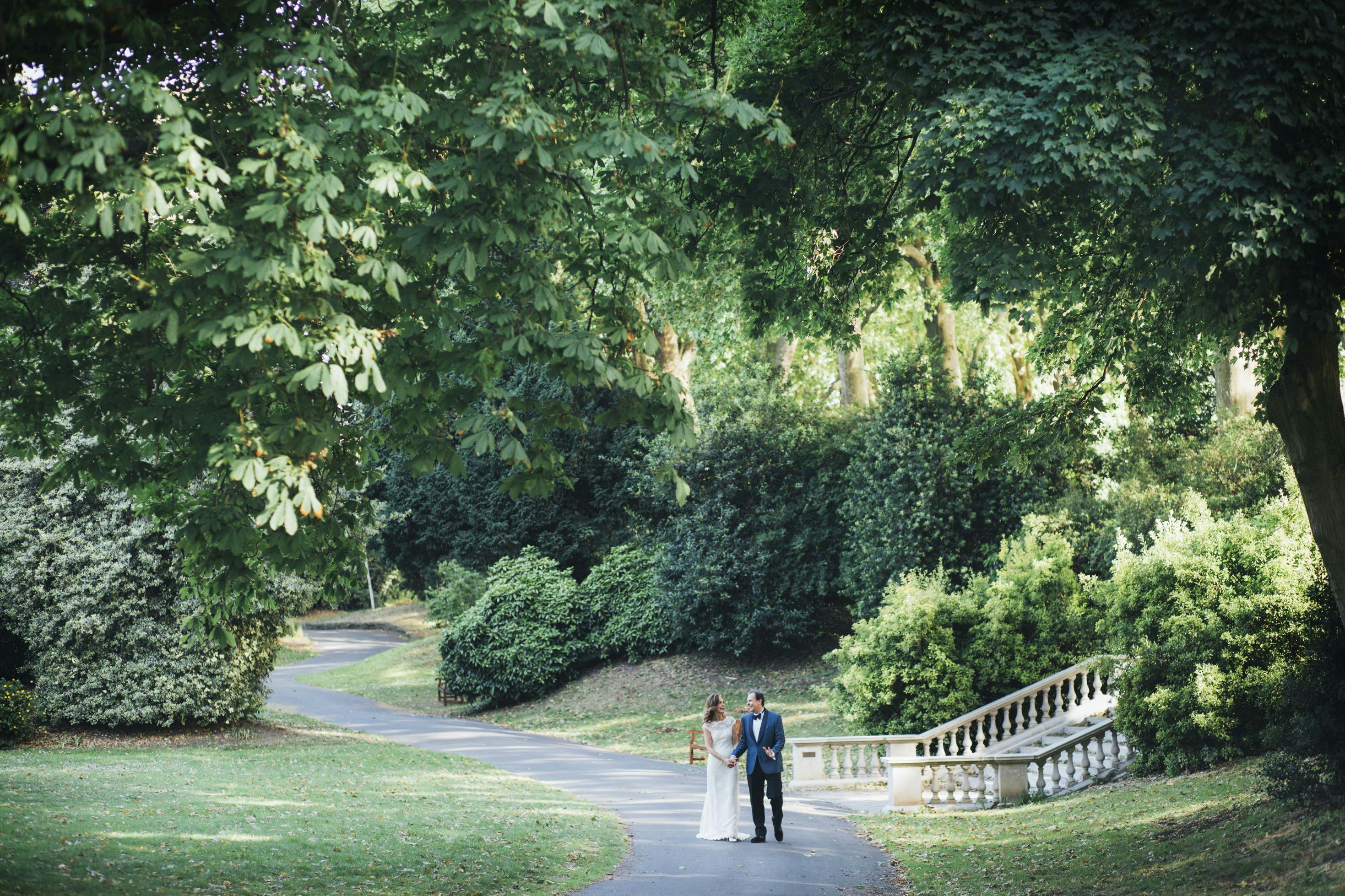 Couple walking in Ranelagh Gardens, Chelsea, perfect for weddings and events.