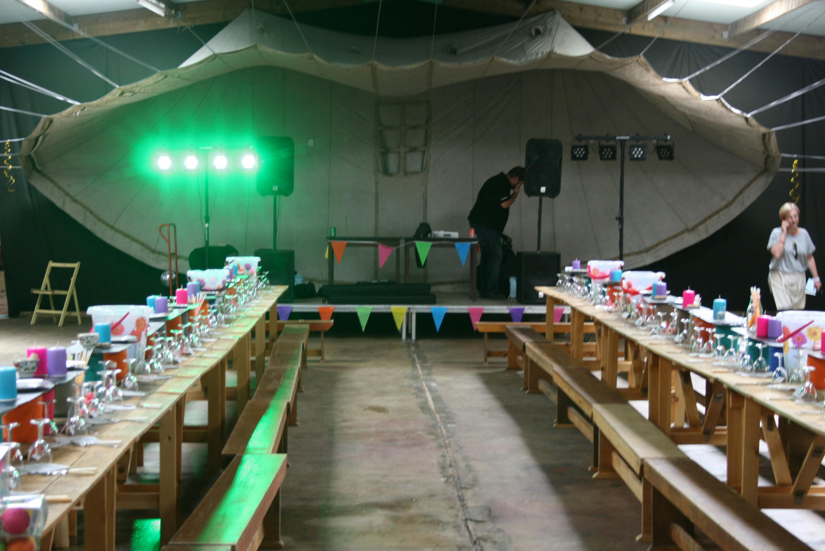 Spacious Camping Meadow setup with banquet tables for festive gatherings and events.