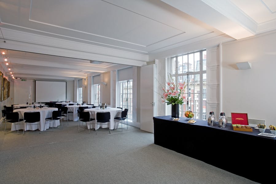 Lutyens Room at RIBA, elegant meeting space with round tables for corporate events.