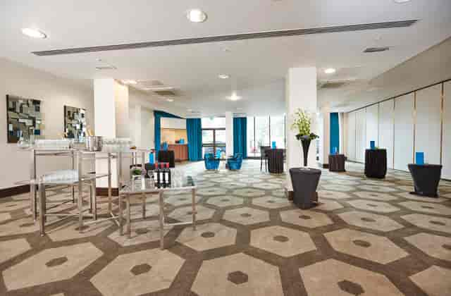 Battersea Room at Hilton London Olympia, modern decor, ideal for meetings and events.