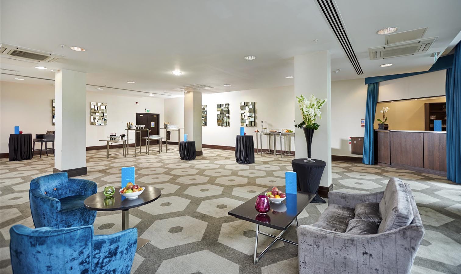 Modern Battersea Room at Hilton London Olympia, perfect for receptions and networking events.