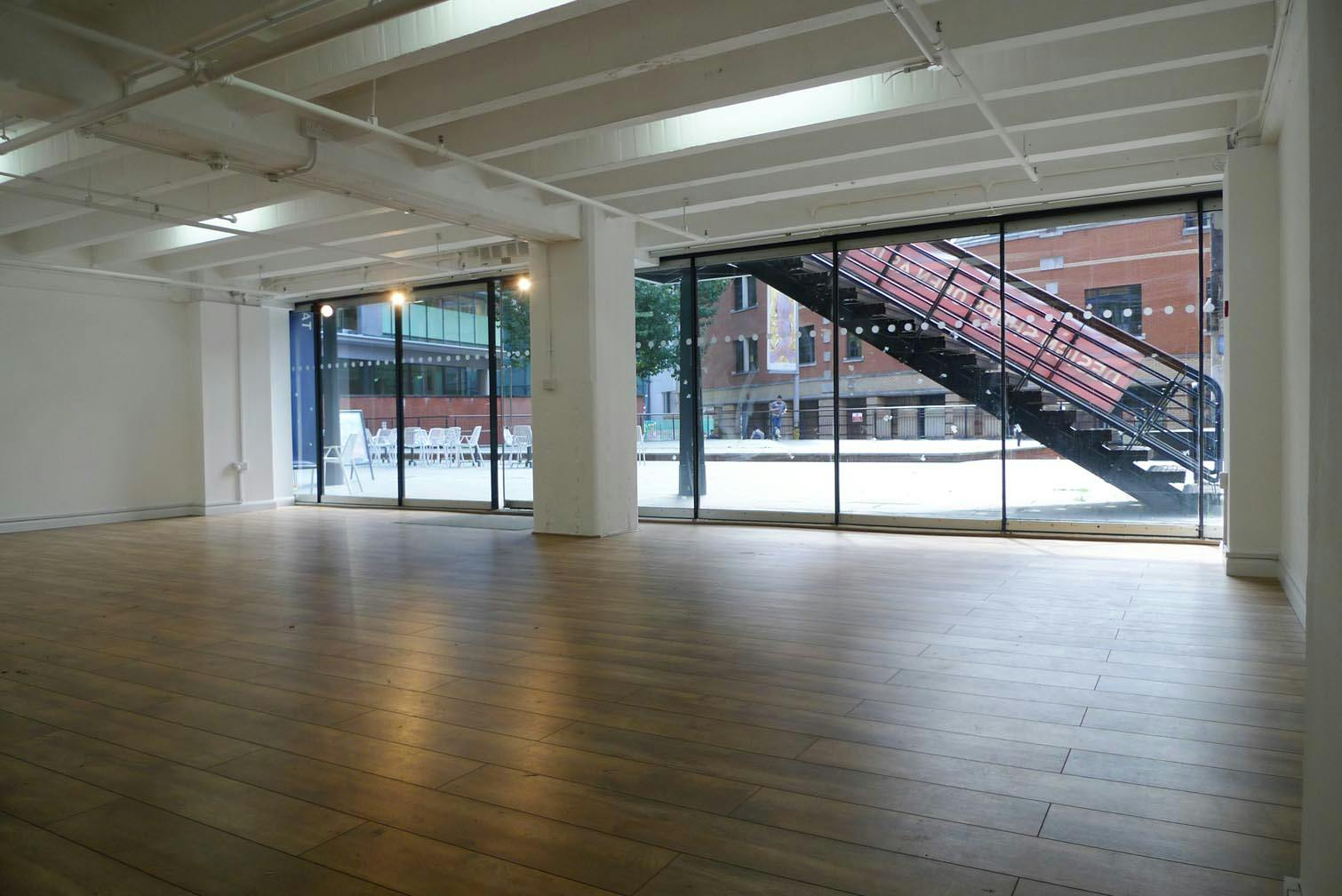 Versatile G11 event space in OXO Tower with natural light, ideal for meetings and gatherings.