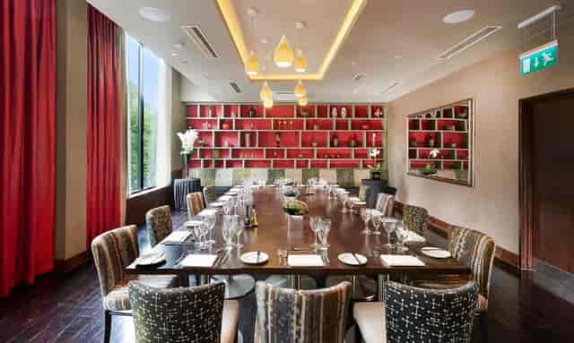 Sophisticated meeting room at Society Restaurant, Hilton London Olympia, ideal for executive events.