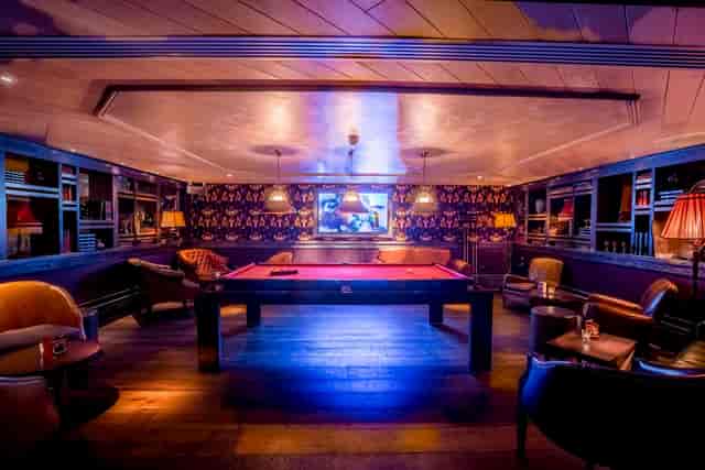 Stylish lounge with pool table for networking events at 100 Wardour Street.