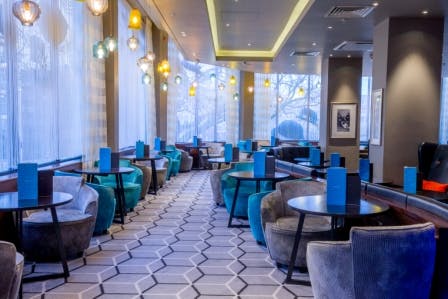 Stylish Society Bar at Hilton London Olympia, perfect for networking events and meetings.