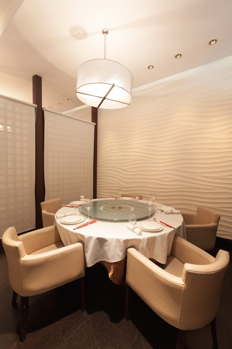 Elegant private dining room with round table for exclusive meetings and events.