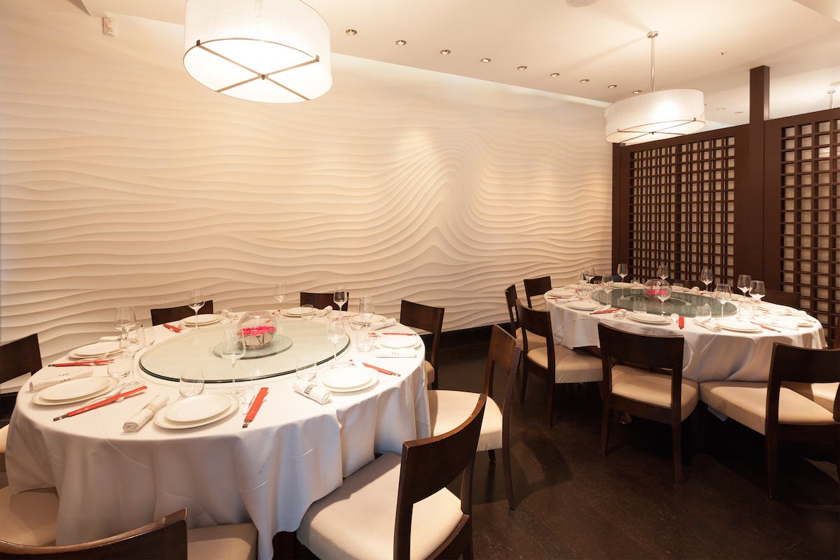 Private Dining Room 1 with round tables for upscale events and intimate gatherings.