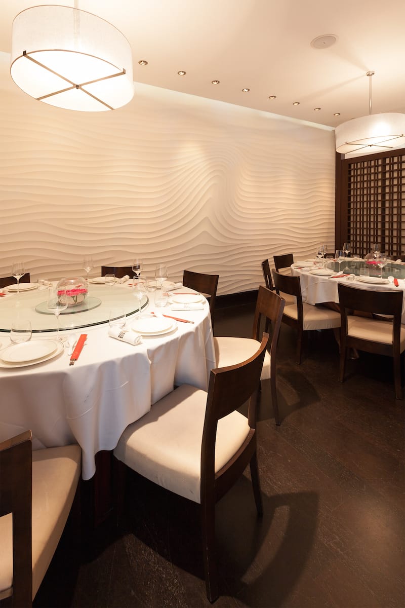Private dining room with round table, ideal for corporate events and intimate gatherings.