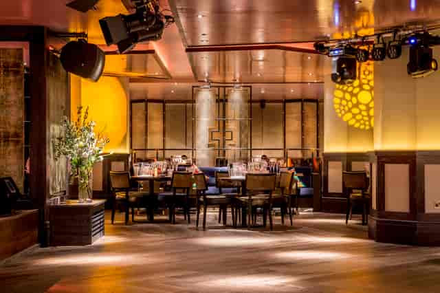 Sophisticated dining space at Carnaby, warm lighting for corporate events and intimate gatherings.