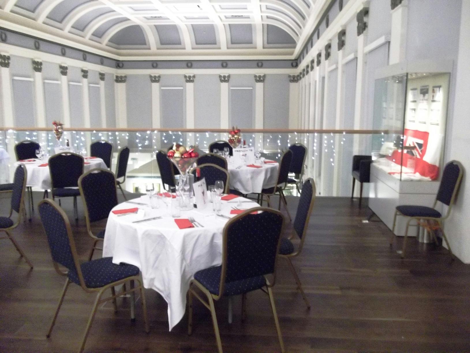 Elegant event space at Shrewsbury Museum with round tables for weddings and corporate events.