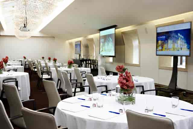 State Rooms & Rooftop Terrace with elegant round tables for corporate meetings.