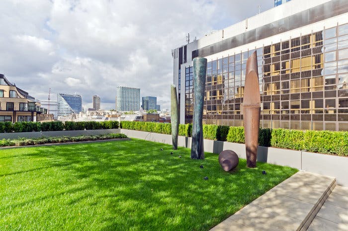 Roof Garden in Liverpool Street: modern outdoor space with sculptures for networking events.