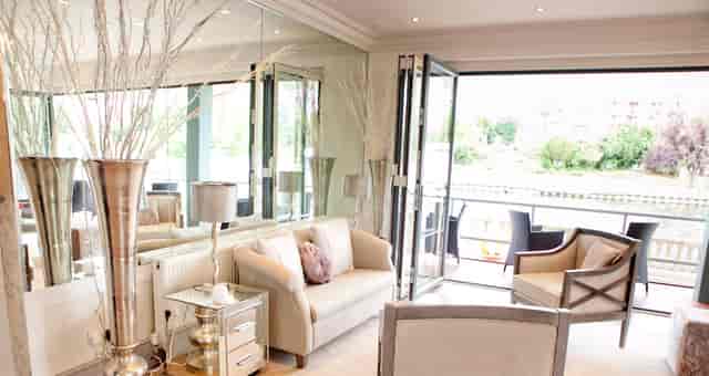 Stylish meeting space with large windows for intimate gatherings on Ravens Ait Island.